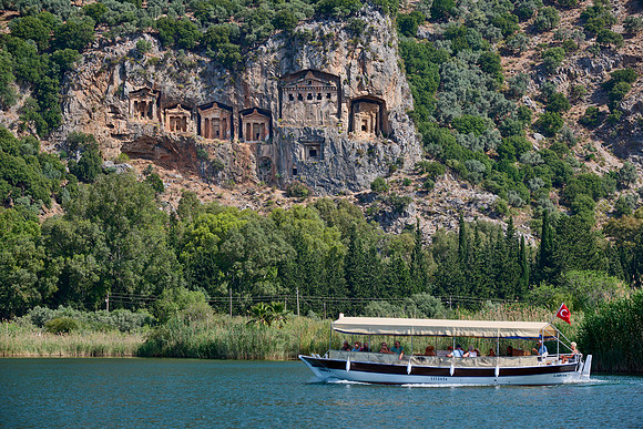Tourist ship in front of Lycian rock tombs