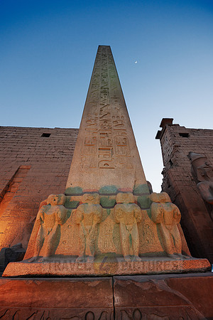 Closeup of illuminated red granite obelisk