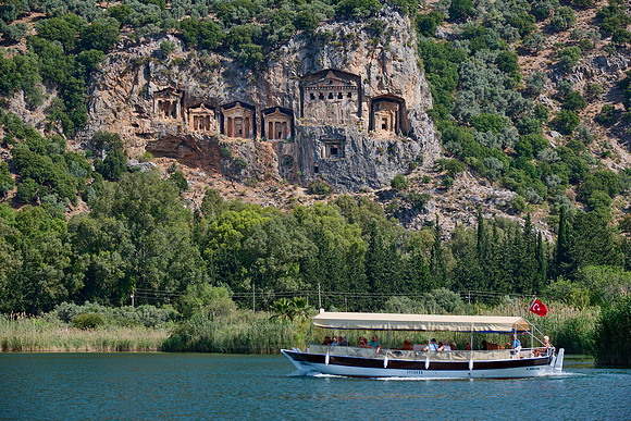 Tourist ship in front of Lycian rock tombs