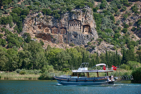 Tourist ship in front of Lycian rock tombs