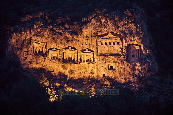 night shot of illuminated Lycian rock tombs in a rock face of Dalyan