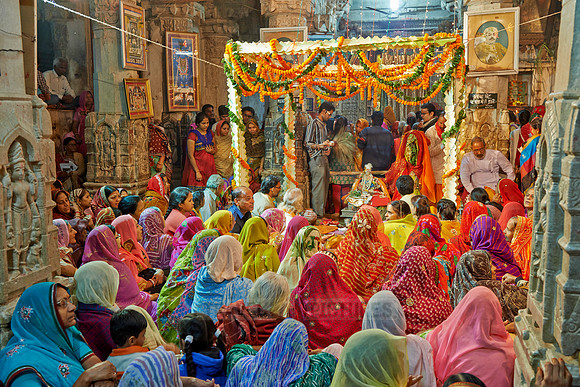 colorful hindu women during ceremony