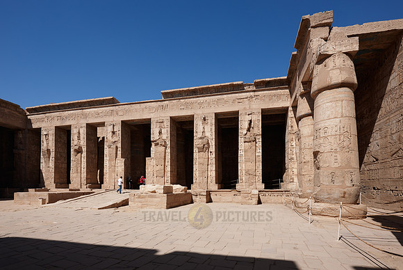 Columns of god Osiris at western colonade in second yard