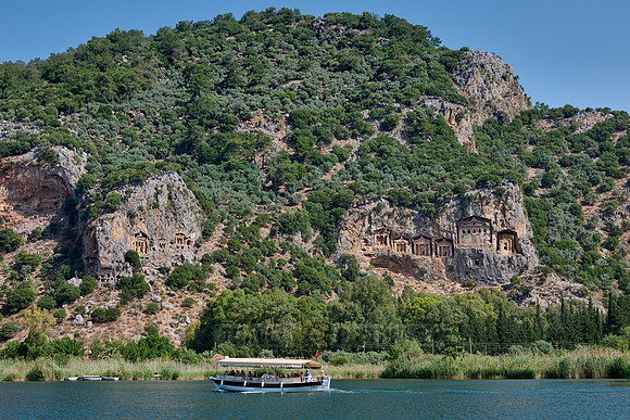 Tourist ship in front of Lycian rock tombs