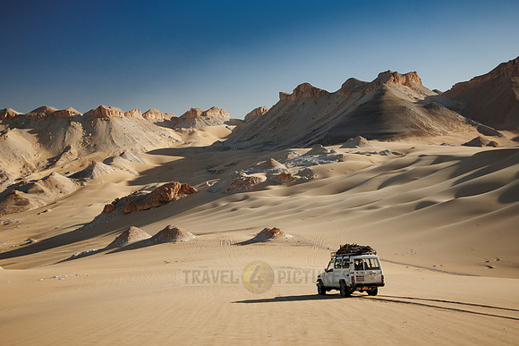 4x4 off road car drive across desert landscape