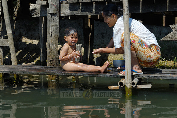 locals washing themself in the lake