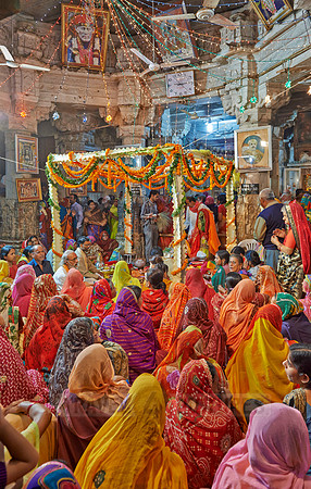 colorful hindu women during ceremony