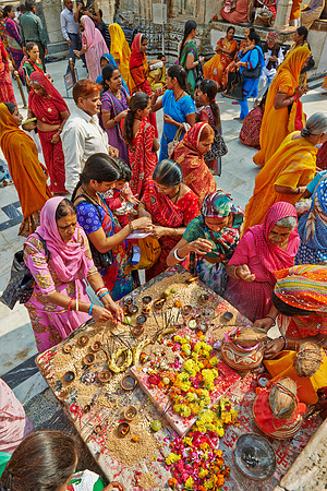 colorful hindu women during ceremony