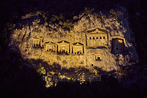 night shot of illuminated Lycian rock tombs in a rock face of Dalyan