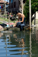 locals washing themself in the lake