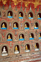 many small Budda figures in niches
