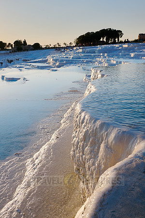 sunset behind Pamukkale travertine terraces