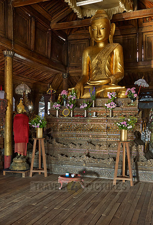 main golden Buddha statue inside Shwe Yaungwe monastery