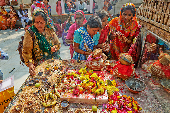 colorful hindu women during ceremony