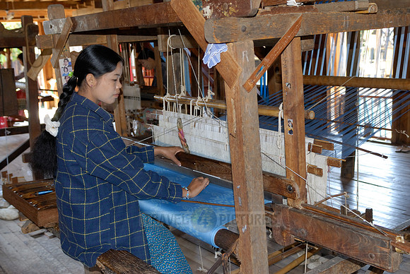 weaving cloth on looms