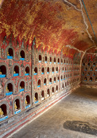 many small Budda figures in niches