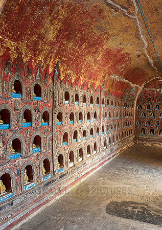many small Budda figures in niches
