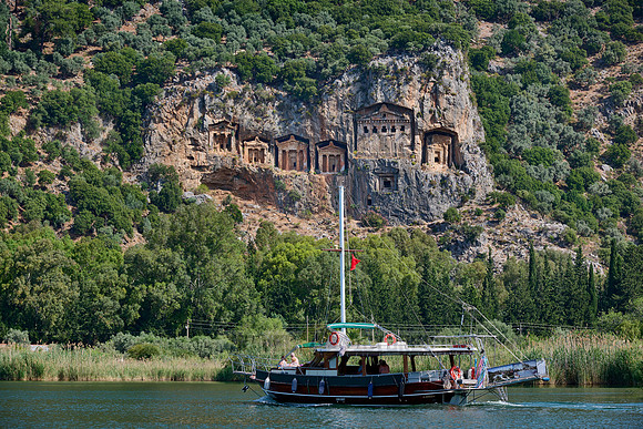 Tourist ship in front of Lycian rock tombs