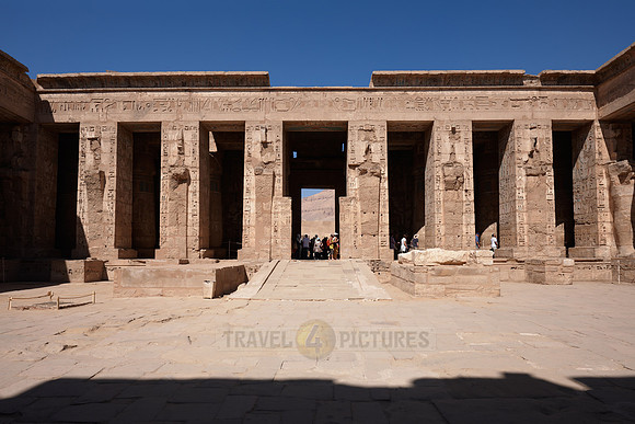 Columns of god Osiris at western colonade in second yard