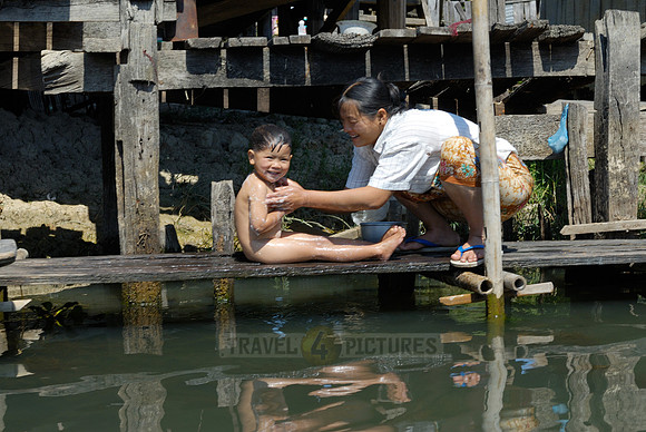 locals washing themself in the lake