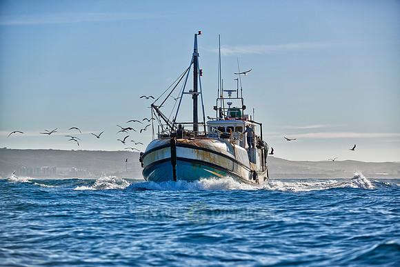 fishing vessel running out for fishing