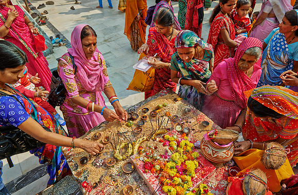 colorful hindu women during ceremony