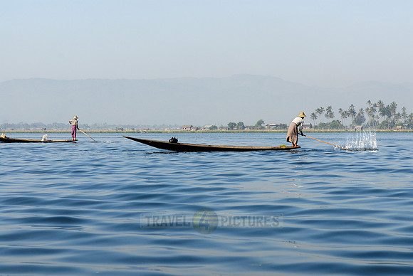 one leg rowing boat with fisherman